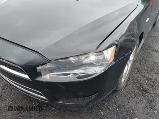 2014 Mitsubishi Lancer SE with VIN JA32V2FW5EU005615, listed as a IAAI auction lot 42204917 with 141,285 mi miles and . Bid and sale history available at carsss.com. Image 6.