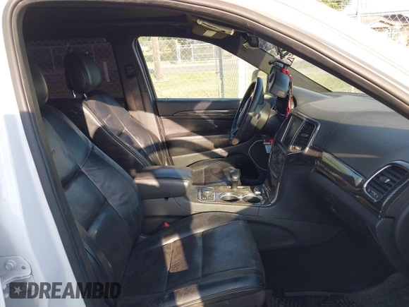 2015 Jeep Grand Cherokee Summit with VIN 1C4RJFJT5FC767687, listed as a IAAI auction lot 42015878 with 1 mi miles. Bid and sale history available at carsss.com. Image 5.