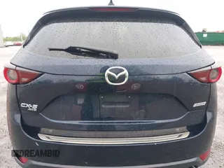 2017 Mazda CX-5 Touring z VIN JM3KFBCL4H0156571, wystawiony jako IAAI lot #42183562 z przebiegiem 135 595 mil mil oraz . Historia ofert i sprzedaży dostępna na DreamBid. Obrazek 17.