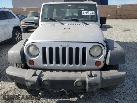 2007 Jeep Wrangler Unlimited X with VIN 1J8GB39157L142982, listed as a Copart auction lot 82050134 with 72,666 mi miles and Salvage Title. Bid and sale history available at DreamBid. Image 5.
