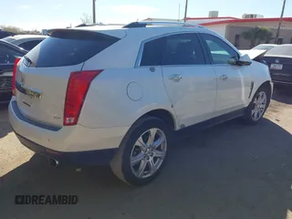 2013 Cadillac SRX Performance Collection with VIN 3GYFNDE37DS599557, listed as a IAAI auction lot 41633569 with 100,611 mi miles and . Bid and sale history available at DreamBid. Image 4.