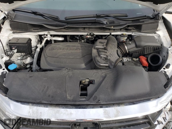 2024 Honda Odyssey Touring z VIN 5FNRL6H81RB063067, wystawiony jako Copart lot #49789175 z przebiegiem 16 581 mil mil oraz Szkoda całkowita • Salvage title. Historia ofert i sprzedaży dostępna na DreamBid. Obrazek 13.