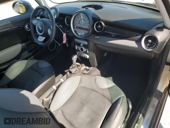 2009 MINI Hardtop S with VIN WMWMF73559TW83208, listed as a Copart auction lot 57347015 with 76,898 mi miles and Salvage title. Bid and sale history available at DreamBid. Image 8.