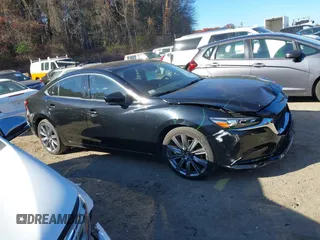2018 Mazda 6 Grand Touring with VIN JM1GL1TY0J1319083, listed as a IAAI auction lot 40852818 with 57,408 mi miles and . Bid and sale history available at DreamBid. Image 13.