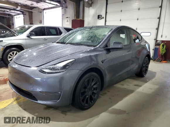 2023 Tesla Model Y Long Range z VIN 7SAYGDEE8PF814874, wystawiony jako Copart lot #56546365 z przebiegiem 20 919 mil mil oraz Szkoda całkowita • Salvage title. Historia ofert i sprzedaży dostępna na DreamBid. Obrazek 1.