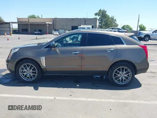 2015 Cadillac SRX Performance Collection with VIN 3GYFNFE35FS569682, listed as a IAAI auction lot 42322229 with 124,365 mi miles and . Bid and sale history available at DreamBid. Image 14.