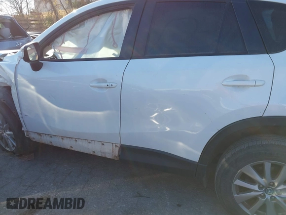 2016 Mazda CX-5 Touring z VIN JM3KE2CY9G0807688, wystawiony jako IAAI lot #41039438 z przebiegiem 169 483 mil mil oraz . Historia ofert i sprzedaży dostępna na DreamBid. Obrazek 15.