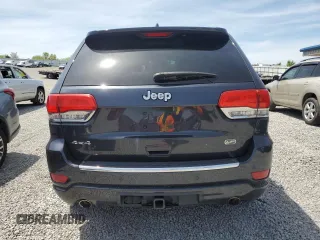 2016 Jeep Grand Cherokee Overland with VIN 1C4RJFCG9GC338165, listed as a Copart auction lot 54125815 with 102,302 mi miles and Salvage title. Bid and sale history available at DreamBid. Image 6.