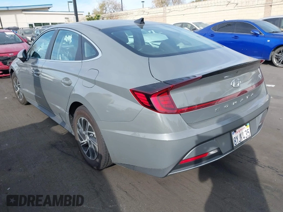 2022 Hyundai Sonata Hybrid Blue with VIN KMHL24JJ5NA037502, listed as a IAAI auction lot 40975379 with 69,018 mi miles. Bid and sale history available at carsss.com. Image 3.