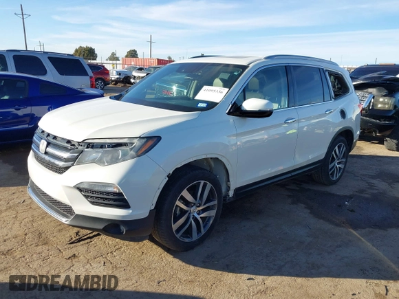 2017 Honda Pilot Touring with VIN 5FNYF6H93HB056387, listed as a IAAI auction lot 41095336 with 90,376 mi miles and . Bid and sale history available at DreamBid. Image 17.