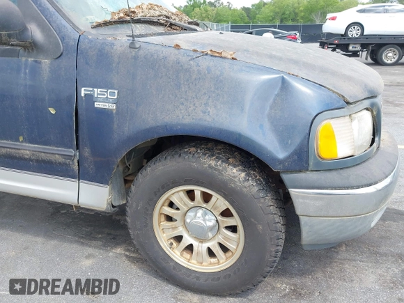 2003 Ford F-150 XLT with VIN 1FTRW076X3KC61967, listed as a IAAI auction lot 42016065 with 206,256 mi miles. Bid and sale history available at carsss.com. Image 13.