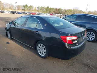 2014 Toyota Camry Hybrid LE with VIN 4T1BD1FK8EU113508, listed as a IAAI auction lot 42068470 with 386,932 mi miles. Bid and sale history available at carsss.com. Image 3.