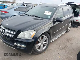 2012 Mercedes-Benz GL 450 z VIN 4JGBF7BE7CA795275, wystawiony jako IAAI lot #41274429 z przebiegiem 141 818 mil mil oraz . Historia ofert i sprzedaży dostępna na DreamBid. Obrazek 2.