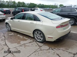 2014 Lincoln MKZ z VIN 3LN6L2G95ER808560, wystawiony jako IAAI lot #42288383 z przebiegiem 97 298 mil mil oraz . Historia ofert i sprzedaży dostępna na DreamBid. Obrazek 3.