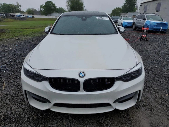 2018 BMW M3 z VIN WBS8M9C5XJ5L71702, wystawiony jako Copart lot #55657055 z przebiegiem Nie podano mil oraz Szkody całkowita. Historia ofert i sprzedaży dostępna na DreamBid. Obrazek 5.