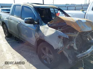 2023 Honda Ridgeline RTL z VIN 5FPYK3F54PB043891, wystawiony jako IAAI lot #41164618 z przebiegiem Nie podano mil oraz . Historia ofert i sprzedaży dostępna na DreamBid. Obrazek 1.