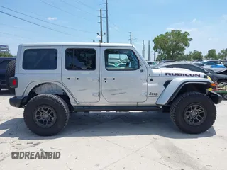2023 Jeep Wrangler Rubicon with VIN 1C4JJXFG0PW522651, listed as a IAAI auction lot 42112210 with 7,744 mi miles and . Bid and sale history available at carsss.com. Image 14.