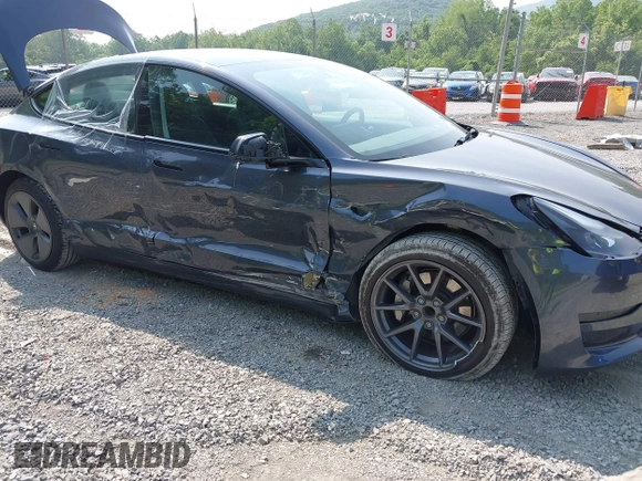 2023 Tesla Model 3 with VIN 5YJ3E1EA2PF566047, listed as a IAAI auction lot 42481008 with 21,143 mi miles and . Bid and sale history available at DreamBid. Image 6.