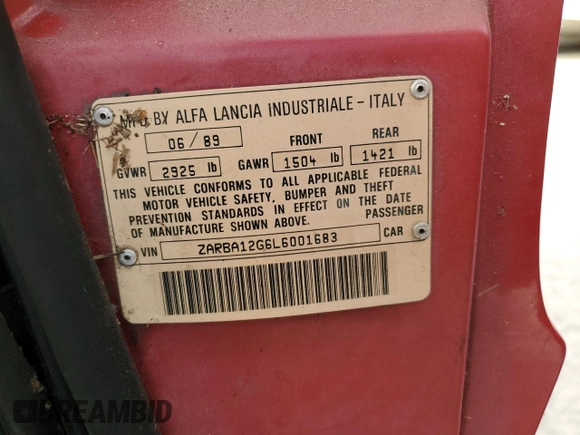 1990 Alfa Romeo Spider z VIN ZARBA12G6L6001683, wystawiony jako Copart lot #75611344 z przebiegiem 59 515 mil mil oraz Szkoda całkowita • Salvage title. Historia ofert i sprzedaży dostępna na DreamBid. Obrazek 13.