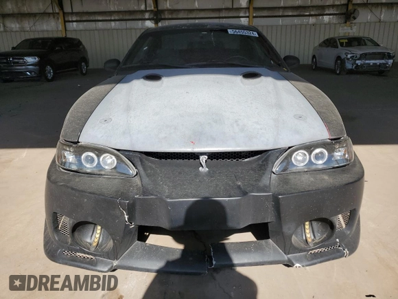 1997 Ford Mustang Cobra with VIN 1FALP47V8VF103811, listed as a Copart auction lot 56455324 with 129,499 mi miles and Salvage Title. Bid and sale history available at carsss.com. Image 5.