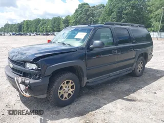 2004 Chevrolet Suburban Z71 z VIN 3GNFK16Z74G158523, wystawiony jako IAAI lot #42495502 z przebiegiem 303 931 mil mil oraz . Historia ofert i sprzedaży dostępna na DreamBid. Obrazek 2.