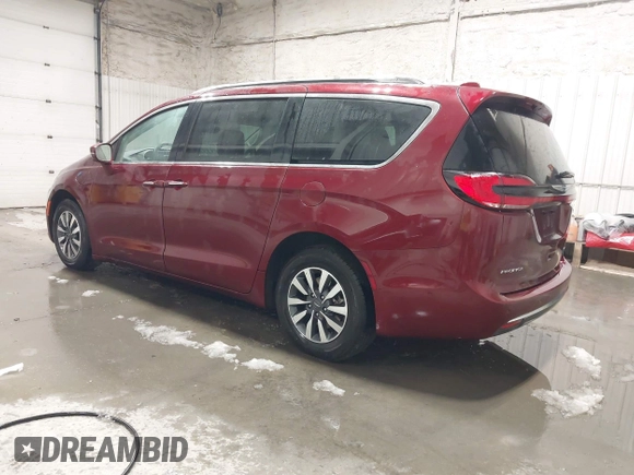 2021 Chrysler Pacifica Hybrid Touring L with VIN 2C4RC1L71MR581260, listed as a IAAI auction lot 42014401 with 68,719 mi miles and . Bid and sale history available at DreamBid. Image 3.