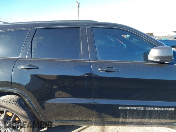2021 Jeep Grand Cherokee 80th Anniversary with VIN 1C4RJFBG9MC527654, listed as a IAAI auction lot 41212055 with 92,436 mi miles and . Bid and sale history available at DreamBid. Image 13.
