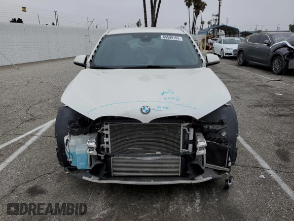 2021 BMW X1 xDrive28i with VIN WBXJG9C09M5U35093, listed as a Copart auction lot 65509155 with 46,875 mi miles and Salvage title. Bid and sale history available at DreamBid. Image 5.