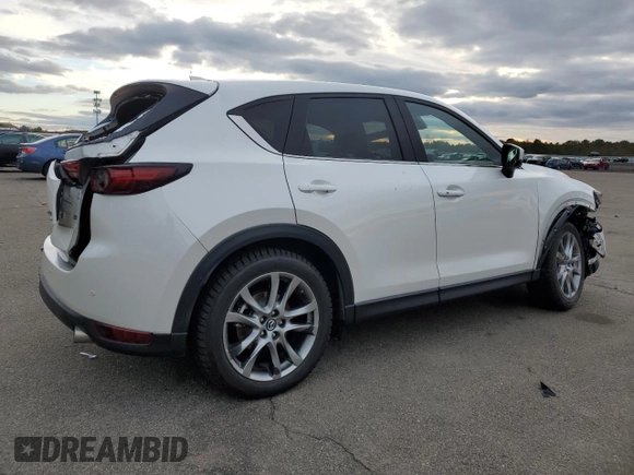 2021 Mazda CX-5 Signature with VIN JM3KFBEY5M0421694, listed as a Copart auction lot 85709714 with 28,126 mi miles and Salvage Title. Bid and sale history available at carsss.com. Image 3.