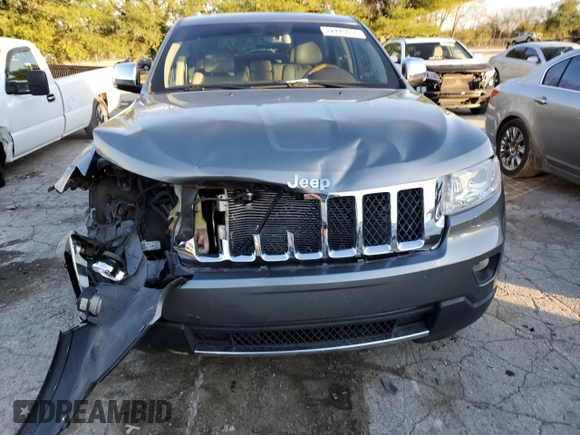 2011 Jeep Grand Cherokee Overland with VIN 1J4RS6GGXBC601757, listed as a Copart auction lot 82770454 with 132,109 mi miles and Salvage Title. Bid and sale history available at DreamBid. Image 5.