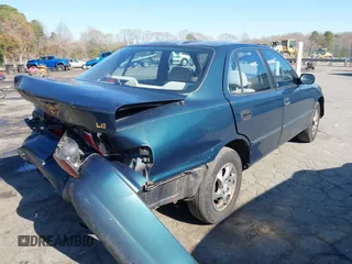 1996 Toyota Camry DX with VIN 4T1BG12K1TU688639, listed as a IAAI auction lot 41883160 with 264,542 mi miles. Bid and sale history available at carsss.com. Image 4.