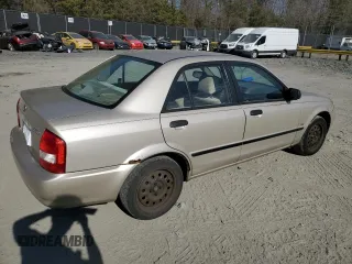 2002 Mazda Protege DX with VIN JM1BJ225520525472, listed as a Copart auction lot 45699915 with 183,457 mi miles and Salvage Title. Bid and sale history available at DreamBid. Image 3.