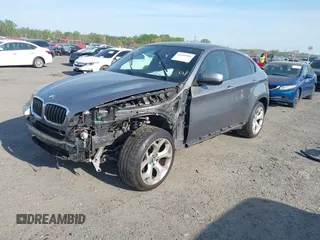 2014 BMW X6 xDrive35i z VIN 5UXFG2C57E0H10305, wystawiony jako IAAI lot #42109416 z przebiegiem 144 816 mil mil oraz . Historia ofert i sprzedaży dostępna na DreamBid. Obrazek 2.
