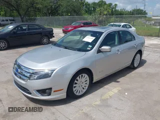 2011 Ford Fusion Hybrid with VIN 3FADP0L38BR249996, listed as a IAAI auction lot 42452194 with 111,316 mi miles and . Bid and sale history available at DreamBid. Image 2.