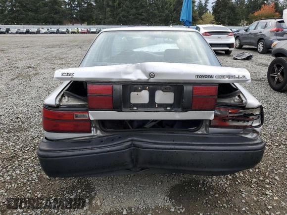 1991 Toyota Corolla z VIN 1NXAE94A8MZ234510, wystawiony jako Copart lot #75002404 z przebiegiem 188 051 mil mil oraz Szkoda całkowita • Salvage title. Historia ofert i sprzedaży dostępna na DreamBid. Obrazek 6.