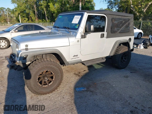 2005 Jeep Wrangler Unlimited with VIN 1J4FA44S65P335444, listed as a IAAI auction lot 41731093 with 143,918 mi miles. Bid and sale history available at carsss.com. Image 17.
