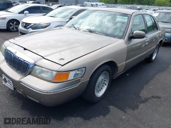 2001 Mercury Grand Marquis LS z VIN 2MEFM75W11X610723, wystawiony jako IAAI lot #42208567 z przebiegiem 190 397 mil mil oraz . Historia ofert i sprzedaży dostępna na DreamBid. Obrazek 2.