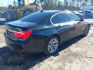 2011 BMW 7 Series 740i with VIN WBAKA4C58BC392020, listed as a IAAI auction lot 41314751 with 116,553 mi miles. Bid and sale history available at carsss.com. Image 4.