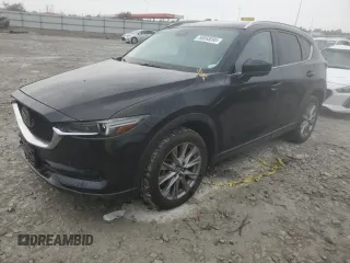 2021 Mazda CX-5 Grand Touring with VIN JM3KFBDM5M0411973, listed as a Copart auction lot 58850095 with 49,513 mi miles and Salvage title. Bid and sale history available at DreamBid. Image 1.