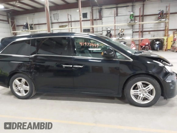2011 Honda Odyssey Touring with VIN 5FNRL5H9XBB055008, listed as a IAAI auction lot 41973447 with 218,762 mi miles and . Bid and sale history available at DreamBid. Image 13.
