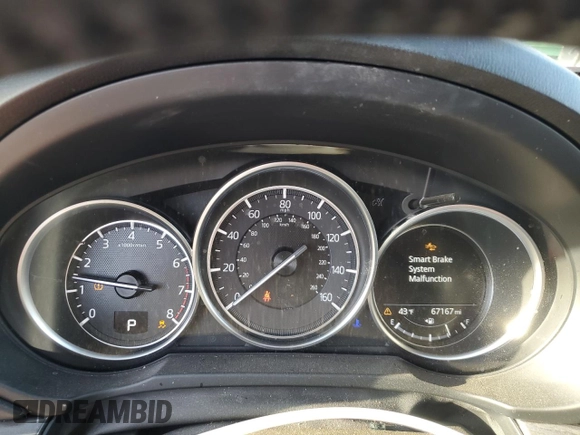 2018 Mazda CX-5 Grand Touring z VIN JM3KFBDMXJ0390680, wystawiony jako Copart lot #51654345 z przebiegiem 67 167 mil mil oraz Szkoda całkowita • Salvage title. Historia ofert i sprzedaży dostępna na DreamBid. Obrazek 9.