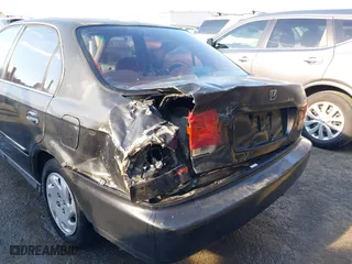 1997 Honda Civic EX with VIN 2HGEJ8645VH566736, listed as a IAAI auction lot 41876647 with 277,968 mi miles. Bid and sale history available at carsss.com. Image 6.