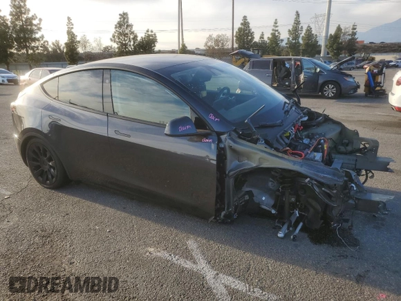 2024 Tesla Model Y with VIN 7SAYGDED7RF056973, listed as a Copart auction lot 87139214 with 15,391 mi miles and Salvage Title. Bid and sale history available at DreamBid. Image 4.