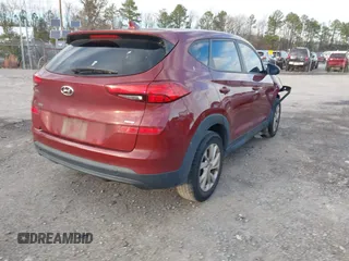 2019 Hyundai Tucson SE with VIN KM8J2CA49KU881841, listed as a IAAI auction lot 41099575 with 129,153 mi miles. Bid and sale history available at carsss.com. Image 4.