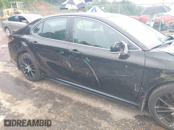 2023 Toyota Camry SE with VIN 4T1G11AKXPU827360, listed as a IAAI auction lot 42217356 with 57,497 mi miles and . Bid and sale history available at DreamBid. Image 6.