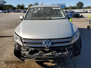 2014 Volkswagen Tiguan SE with VIN WVGAV3AX9EW611860, listed as a Copart auction lot 74431754 with 116,022 mi miles and Salvage title. Bid and sale history available at DreamBid. Image 5.