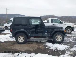 2005 Jeep Wrangler X with VIN 1J4FA39S55P353131, listed as a IAAI auction lot 41575949 with 154,026 mi miles and . Bid and sale history available at DreamBid. Image 13.