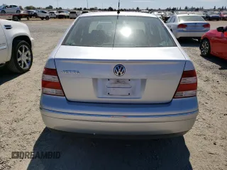 2004 Volkswagen Jetta GL z VIN 3VWRA69M54M007376, wystawiony jako Copart lot #72288984 z przebiegiem 91 687 mil mil oraz Szkoda całkowita • Salvage title. Historia ofert i sprzedaży dostępna na DreamBid. Obrazek 6.