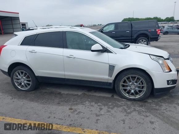 2013 Cadillac SRX Performance Collection z VIN 3GYFNHE35DS569528, wystawiony jako IAAI lot #42329652 z przebiegiem 97 184 mil mil oraz . Historia ofert i sprzedaży dostępna na DreamBid. Obrazek 13.