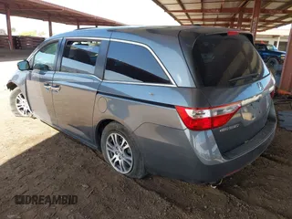 2012 Honda Odyssey EX-L with VIN 5FNRL5H6XCB103498, listed as a IAAI auction lot 42065658 with 104,933 mi miles and . Bid and sale history available at carsss.com. Image 3.